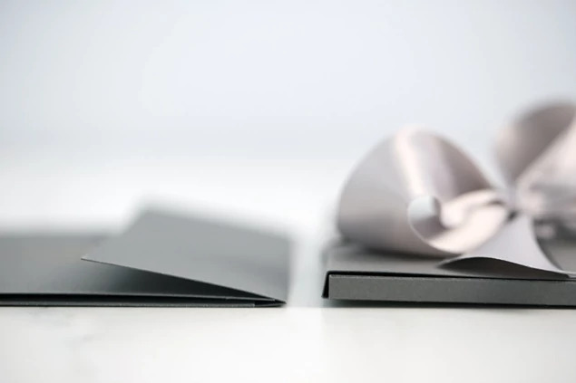 Slate Tyndell Photo Case showing foil imprinted studio logo on smooth slate surface