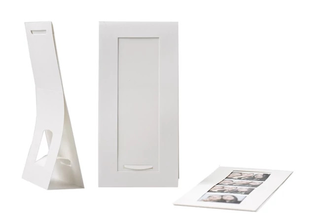 White Photo Booth Easel showing bottom-loading design standing upright holding a 2x6 photo booth strip