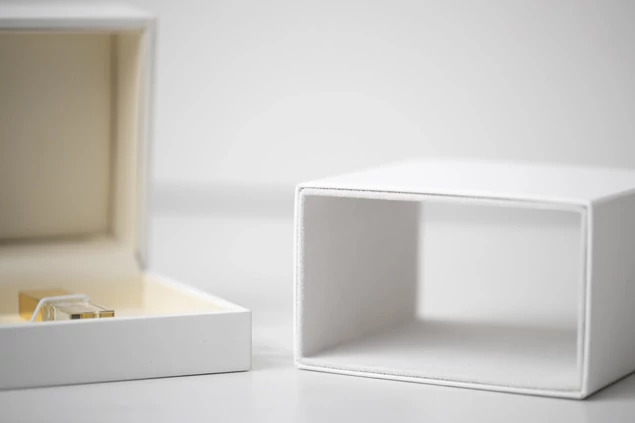 Tyndell White Soft Touch USB Box with full color printed studio logo showing personalization options