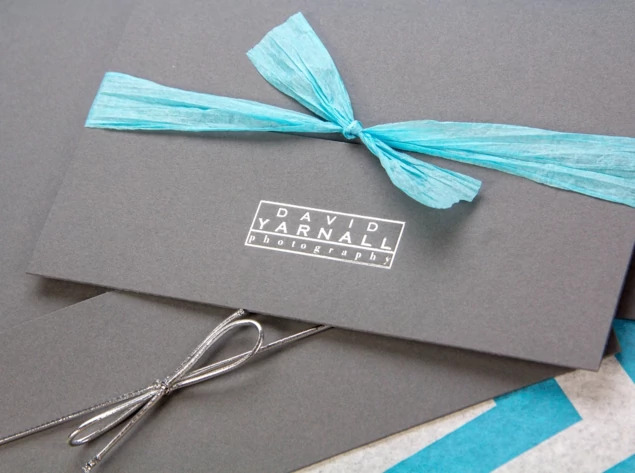 Slate Tyndell Photo Case styled with ribbon and tissue paper accessories for complete portrait delivery