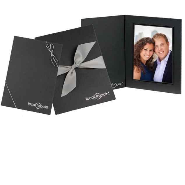 Onyx Folders in multiple sizes showing linen finish with deckle edge border and black foil border detail