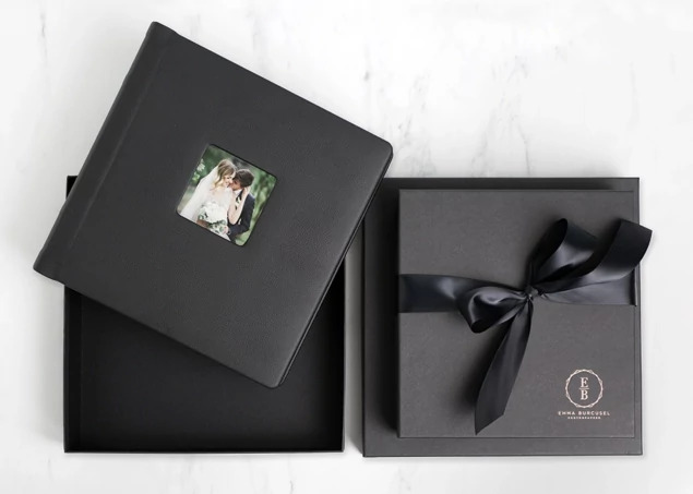 Open matte black album box with square album inside and custom foil studio logo and black ribbon     Tyndell album packaging