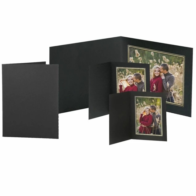Titan Folders in multiple sizes showing black virgin photo mount board with gold foil border and linen texture finish