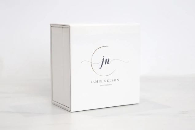 Tyndell White Soft Touch USB Box showing hinged design and boutique packaging for digital image delivery