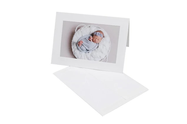 White photo insert card shown with white envelope and 4x6 photo slot