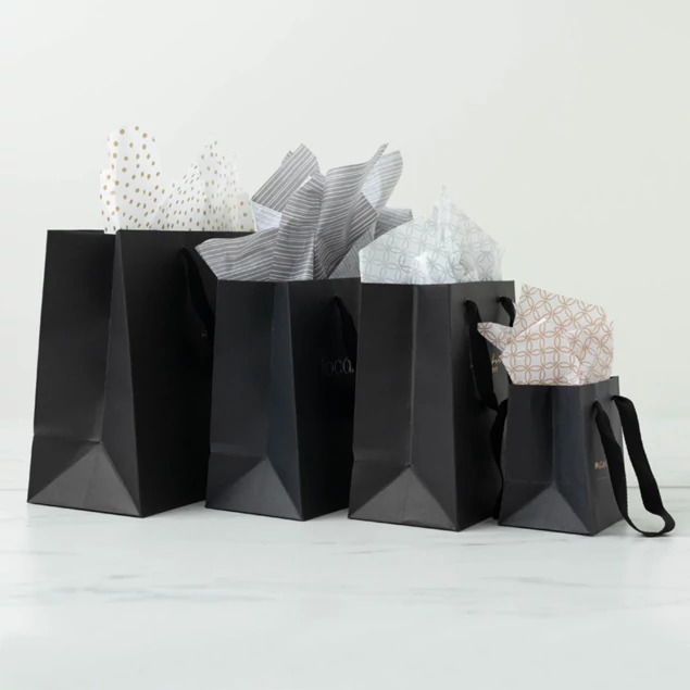 Black Euro Tote bags in two sizes shown with white tissue paper against a clean background