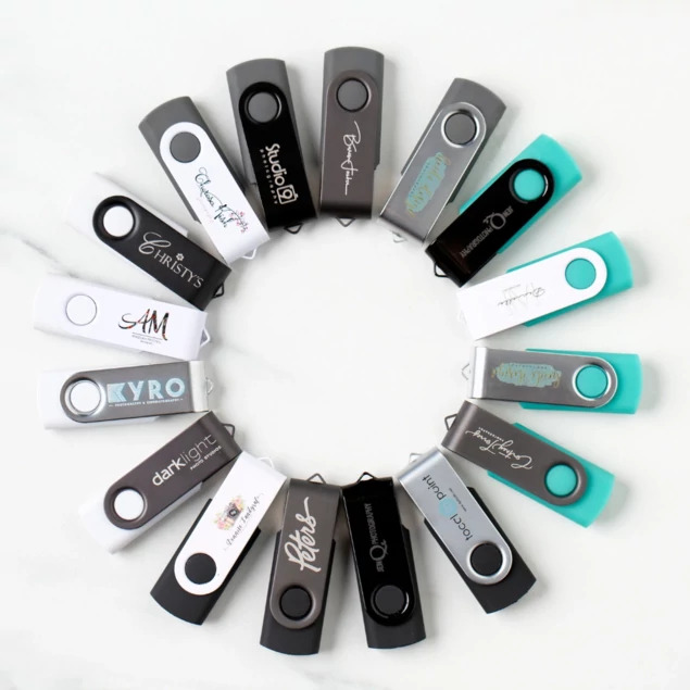 Tyndell Swivel Flash Drives in Black, Titanium, White, and Teal base colors showing swivel design with laser engraving