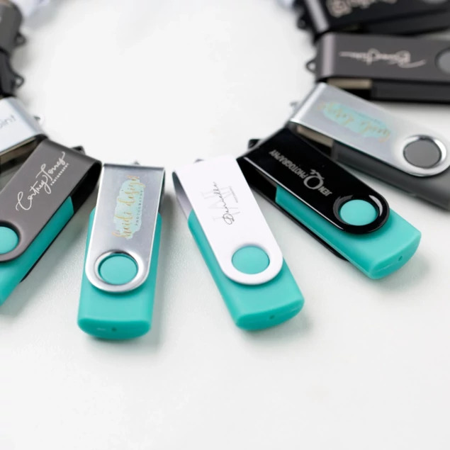 Tyndell Swivel Flash Drive open showing swivel mechanism with engraved studio logo on one side and custom text on other