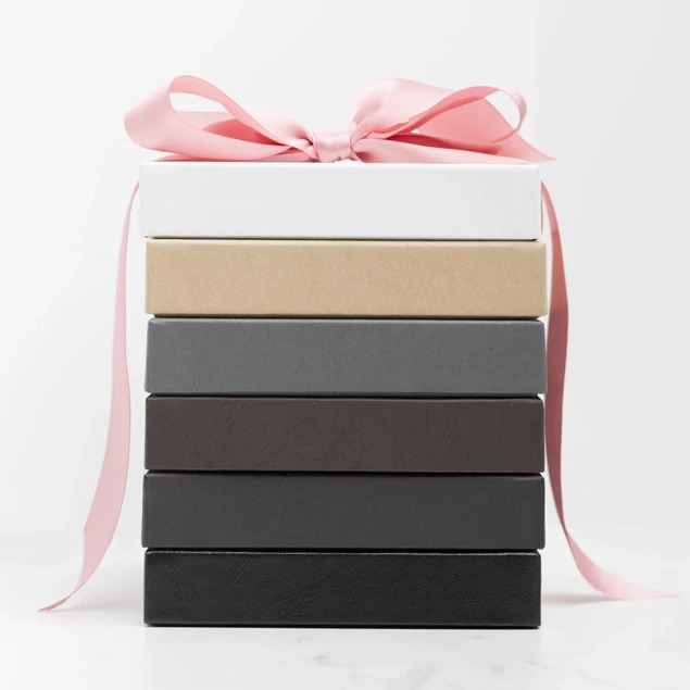 Stacked slate portrait boxes with pink ribbon alongside other portrait box color options     Tyndell portrait box collection