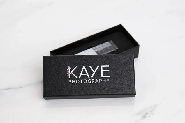 Tyndell USB Gift Box with full color printed studio logo showing personalization options on black coated surface