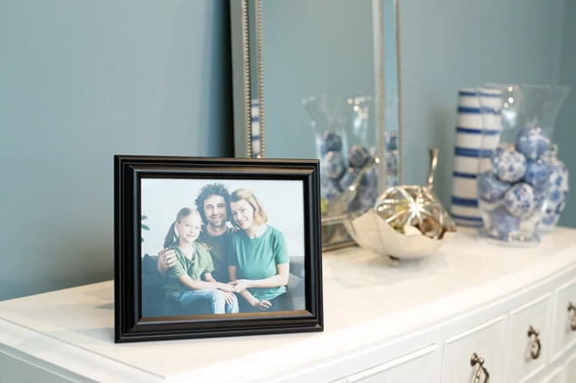 Black Wood Frame in landscape orientation on dresser with family portrait     8x10 black wood photo frame