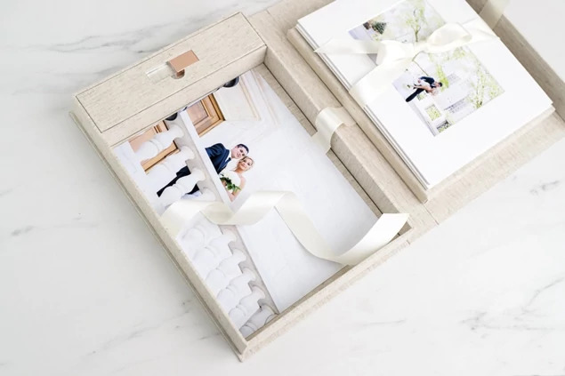 Linen Fabric Flash and Print Box open showing USB slot and satin ribbon with prints inside