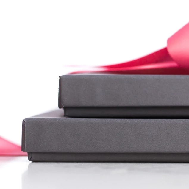 Side profile of slate deluxe portrait box showing raised lid construction and slim profile     Tyndell portrait packaging