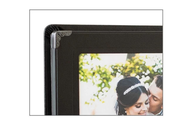 Camden Album open showing close-up of black gilded pages with full-size portrait image