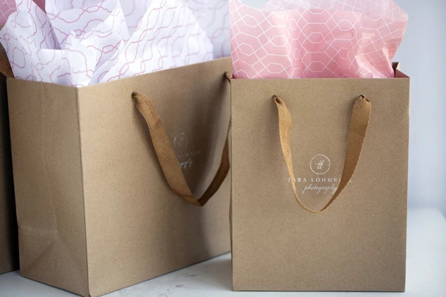 Two kraft Euro Tote bags shown together displaying natural finish and cotton twill ribbon handles