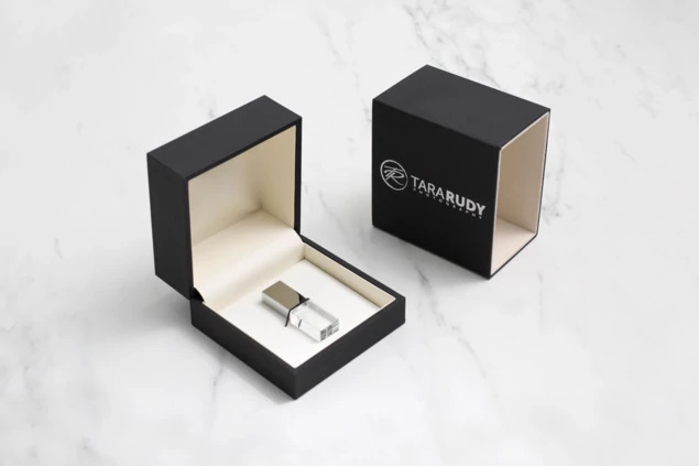 Black Luxe Soft Touch USB Box open showing ivory suede lining and elastic band for flash drive