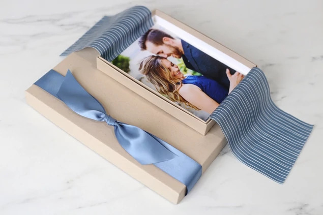  Kraft portrait box open with wedding portrait print and blue ribbon     Tyndell portrait packaging