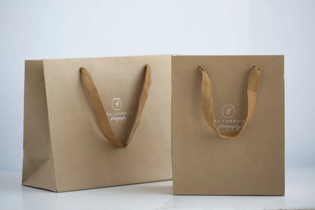 Two kraft Euro Tote bags in different sizes shown plain highlighting natural kraft construction