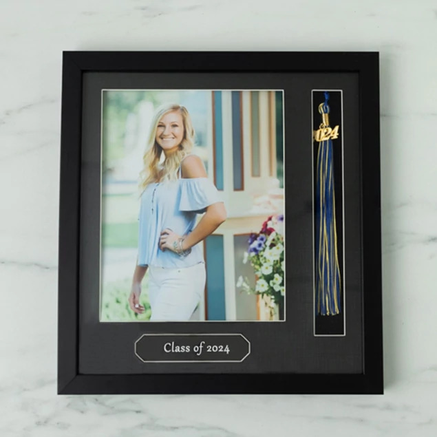 Tyndell Tassel Frame in 8x10 showing black wood frame with white border holding portrait, graduation year, and tassel