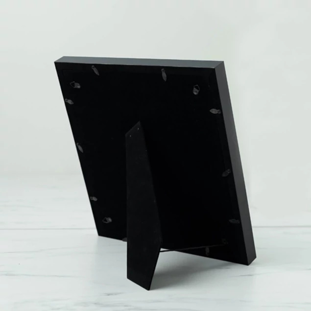 Tyndell Tassel Frame back showing easel stand and triangle hooks for wall mounting vertically or horizontally