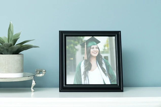 Black Wood Frame displayed on shelf holding graduation portrait     satin black solid wood frame for photographers