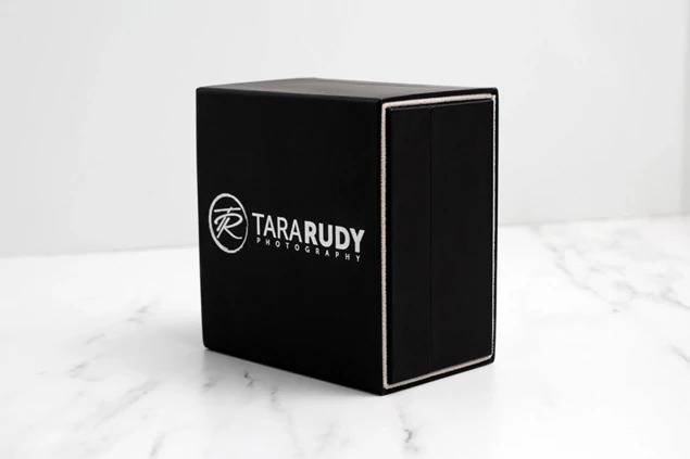 Black Luxe Soft Touch USB Box with slip-in protective cover showing full color printed studio branding