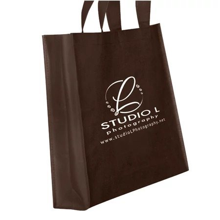 Chocolate frame bag close-up showing nonwoven fabric construction and reinforced shoulder handles