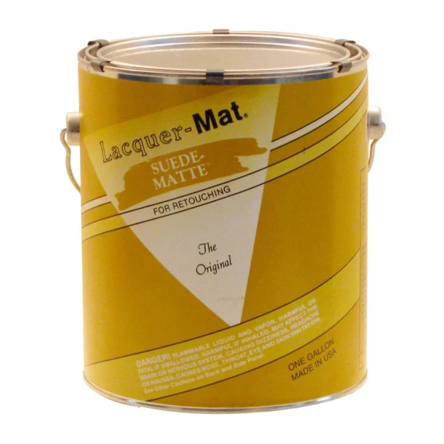 Suede lacquer gallon in yellow can showing suede-like finish for pencil retouching and mixed media work on prints