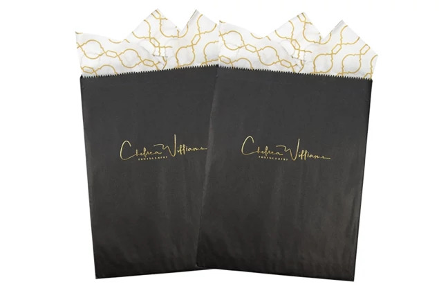 Black flat paper merchandise bags in 8.5x11 and 12x15 sizes for studio photo delivery