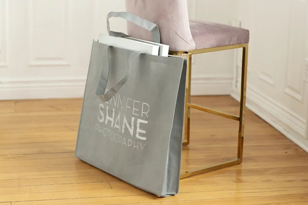 Slate gray frame bag open showing 4.5 inch gusset and capacity for large framed prints and wall art