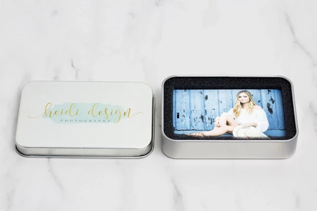 Credit card flash drive and metal tin bundle open showing foam insert holding USB drive securely