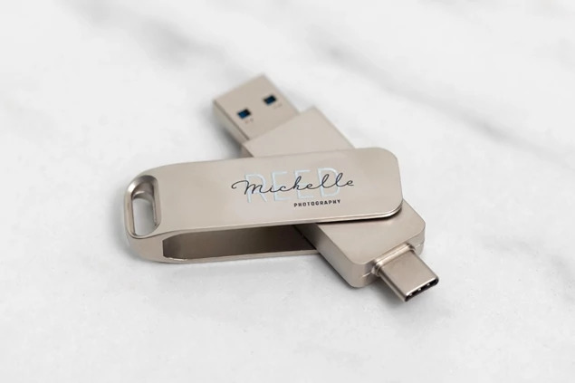 Dual metal flash drive with USB-A 3.0 connector extended showing slim aluminum swivel design
