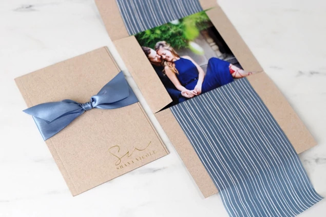 Kraft Tyndell Photo Case showing foil imprinted studio logo on natural kraft linen texture surface