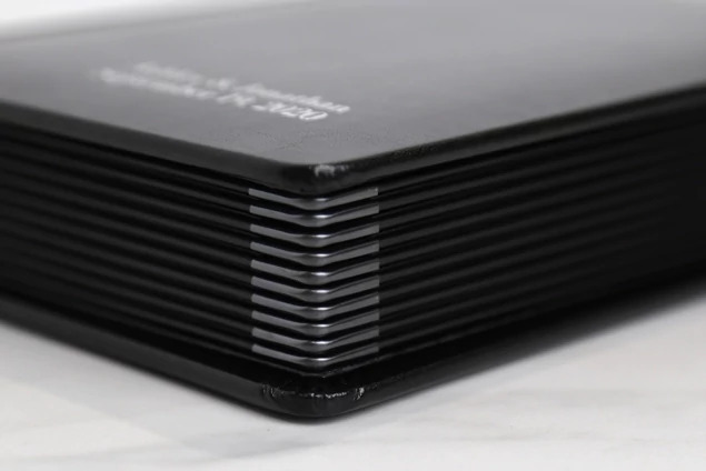 Stack of Camden Albums showing bonded leather covers and decorative rounded spines