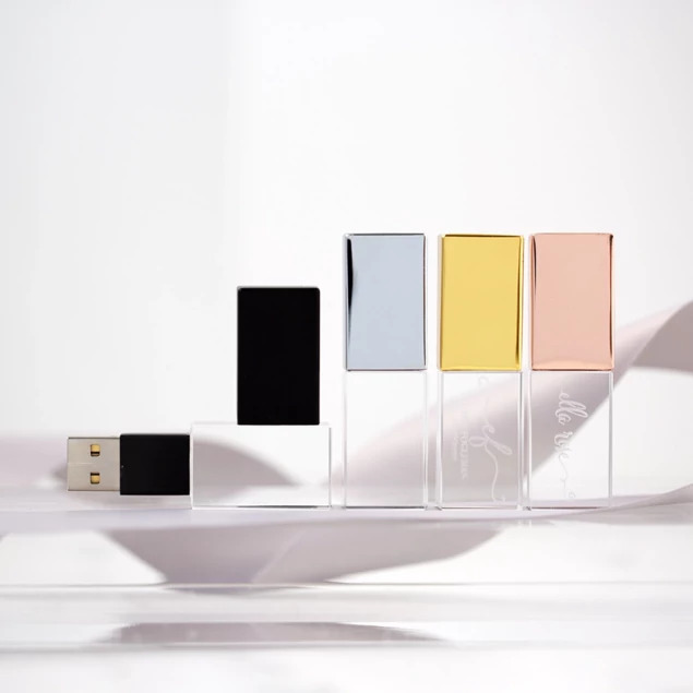 Crystal flash drives in Black, Gold, Rose Gold, and Silver cap colors shown together on white surface