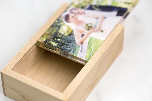 Tyndell Maple Wood USB Slide Box with laser engraved studio logo showing customization on natural maple wood surface