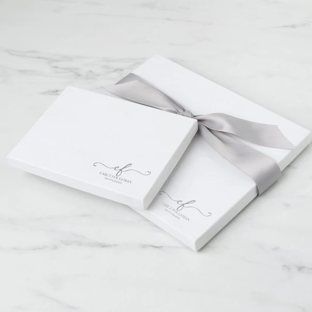Matte white deluxe portrait box open showing white interior with custom foil studio logo     Tyndell portrait packaging