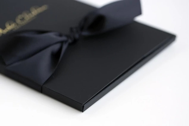 Black Soft Touch Portrait Case styled for wedding or senior portrait delivery with prints inside