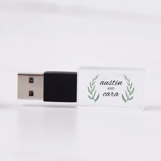 Black cap crystal flash drive with laser engraved studio logo on clear crystal body