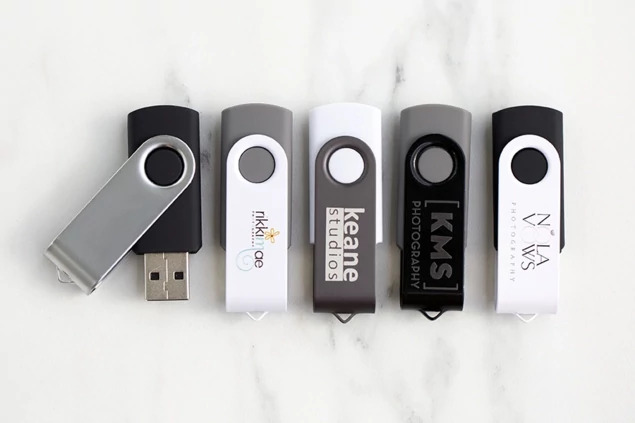 Tyndell Swivel Flash Drive with full color printing showing custom studio logo design on white base