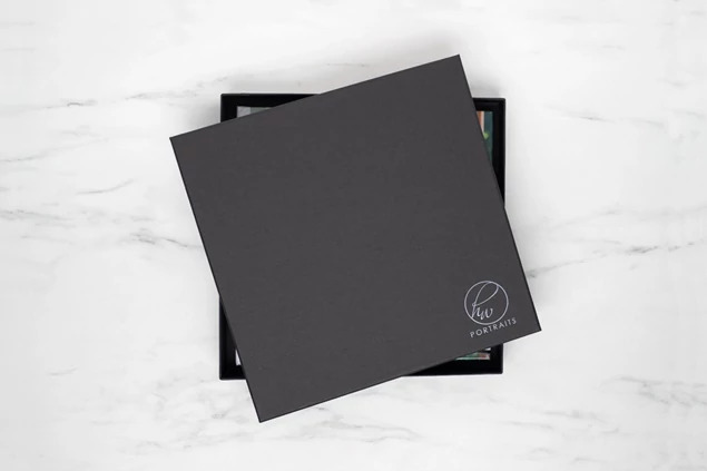 Square Photo Book Box open showing raised lid design and black interior for prints and photo book delivery