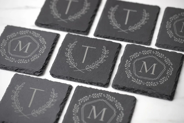 Set of four Tyndell Slate Coasters showing full color printing and laser engraving customization options side by side
