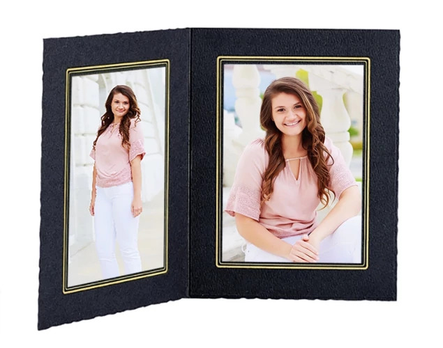 Black Cal Folder open large displaying two senior portrait photos with gold foil border detail