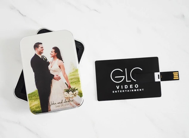 Black and silver metallic credit card flash drives shown together displaying custom full-color printing