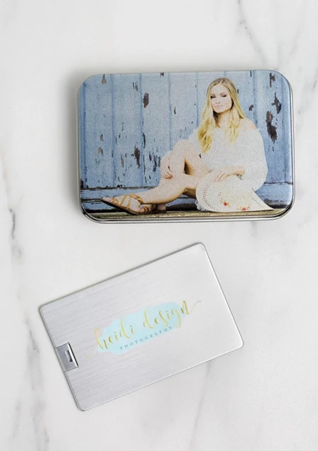 Metal tin box open showing capacity for approximately 50 standard 2.5x3.5 wallet photos